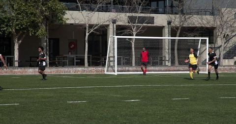 Young Soccer Players Prepping for Free Kick During Practice Match