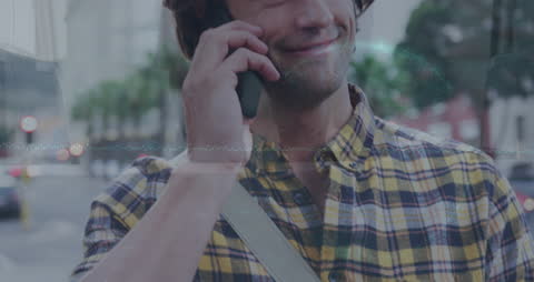 Smiling Man Talking on Phone with Data Overlay