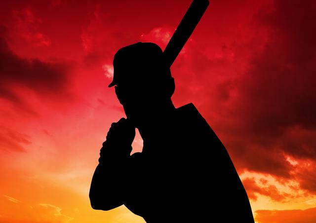 Digital composition of baseball player against colorful sky