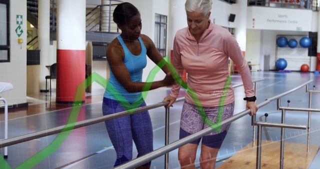 Senior Woman Undergoing Physical Therapy with Female Trainer in Gym - Download Free Stock Images Pikwizard.com