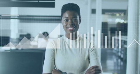 Businesswoman Analyzing Digital Graphs in Office Environment