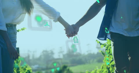 Couple Holding Hands with Eco-Friendly Technology Icons