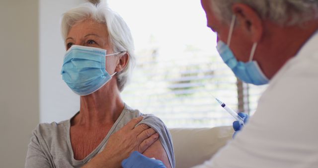 Senior Woman Receiving Vaccine Injection from Healthcare Worker - Download Free Stock Images Pikwizard.com