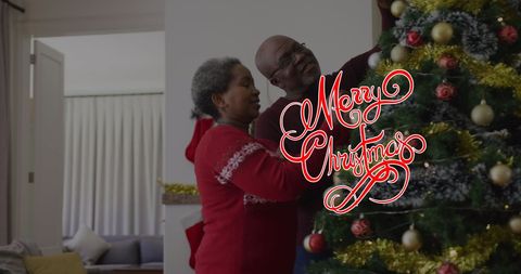 Happy African American Couple Decorating Christmas Tree Together