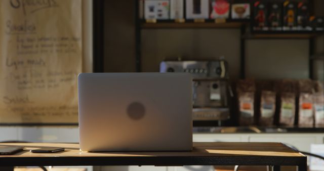 Laptop on Wooden Table in Modern Coffee Shop - Download Free Stock Images Pikwizard.com