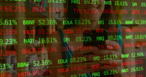 Woman Engaging with Dynamic Stock Market Data Display