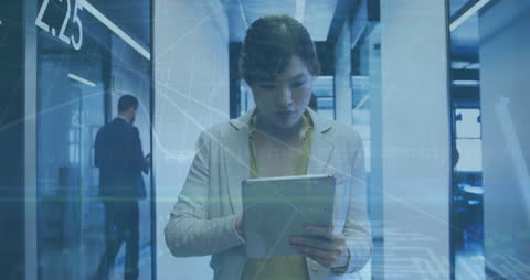 Businesswoman Using Tablet with Digital Interface in Corporate Office