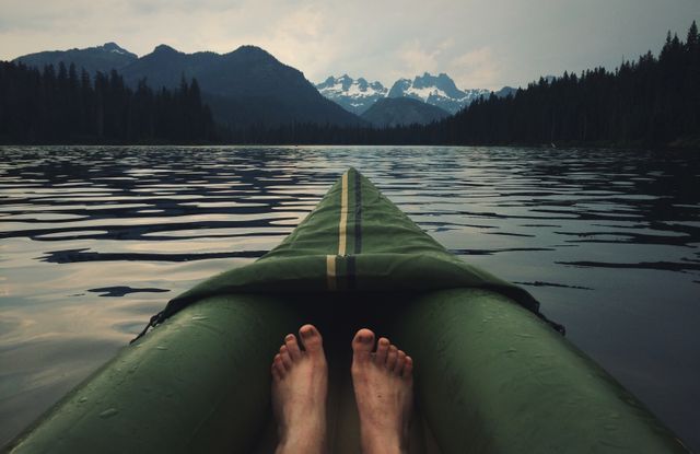 Relaxing Kayaking on Mountain Lake Surrounded by Majestic Peaks - Download Free Stock Photos Pikwizard.com