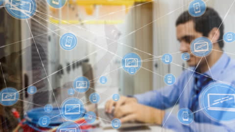 Businessman Using Laptop in Digital Connected Office Environment