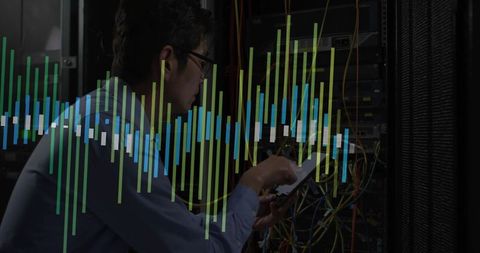 Korean technician configuring network server rack with tablet and live data visualization