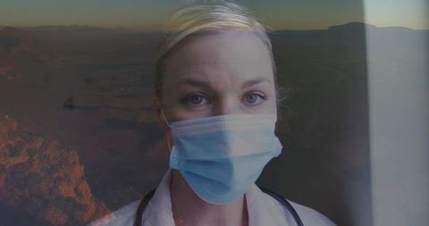 Contemplative Healthcare Worker Overlooking Desert Landscape