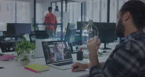 Office scene where a diverse group of business professionals are involved in a virtual meeting. The technology overlay indicates data processing and digital interface, emphasizing its use in modern corporate environments. Ideal for illustrating remote work, technological advancements, and global business practices.