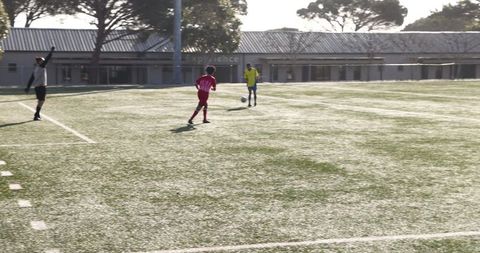 Youth Soccer Match with Players Exhibiting Team Spirit and Strategy