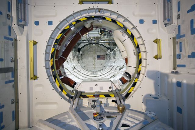 CAPE CANAVERAL, Fla. – In Orbiter Processing Facility-2 at NASA’s Kennedy Space Center in Florida, the camera captures a final view through space shuttle Endeavour’s airlock into the payload bay before the airlock's hatch is closed for the final time during processing for the shuttle’s retirement.     Endeavour is being prepared for public display at the California Science Center in Los Angeles. Its ferry flight to California is targeted for mid-September. Endeavour, designated OV-105, was the last space shuttle added to NASA’s orbiter fleet. Over the course of its 19-year career, Endeavour spent 299 days in space during 25 missions. For more information, visit http://www.nasa.gov/transition.  Photo credit: NASA/Dimitri Gerondidakis