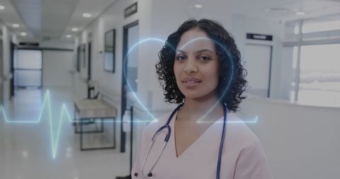 Confident Female Doctor Analyzing Medical Data in Hospital Corridor
