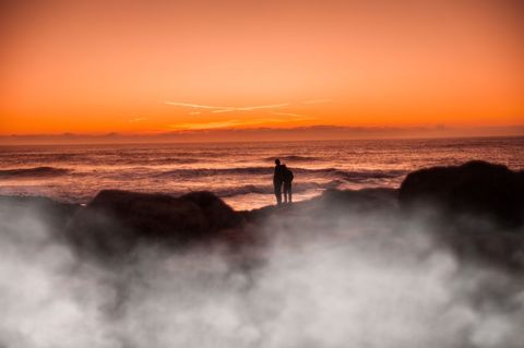 Romantic Couple Embracing Ocean Sunset Silhouette