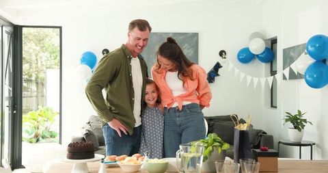 Happy Family Celebrating Birthday Together in Living Room