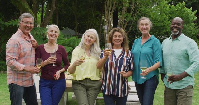 Smiling Group of Diverse Senior Friends Enjoying Wine Outdoors - Download Free Stock Images Pikwizard.com