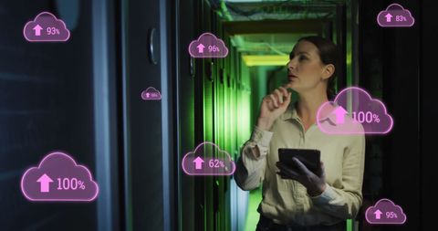 Network engineer analyzing cloud data in high-tech server room