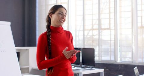 Businesswoman Giving Presentation in Modern Office Bright Atmosphere