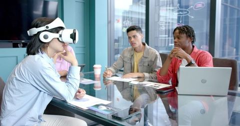 Professionals engaging with vr headset collaboration meeting