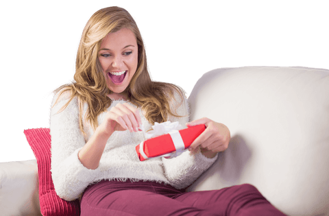 woman enthusiastically opening gift in lively home moment - Download Free Stock Videos Pikwizard.com