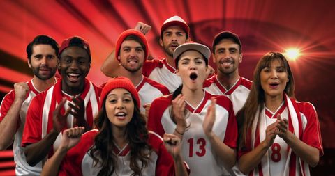 Diverse Group of Enthusiastic Sports Fans Cheering Team Victory