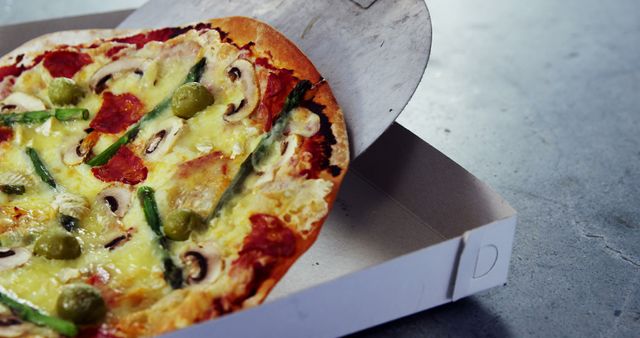 Freshly Baked Thin-Crust Pizza Sliding into Modern Cardboard Box - Download Free Stock Images Pikwizard.com