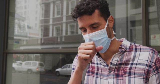 Man Wearing Protective Face Mask Coughing Outside Urban Building - Download Free Stock Images Pikwizard.com