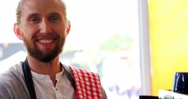 Smiling Barista Wearing Red Checkered Towel Standing in Cafe - Download Free Stock Images Pikwizard.com