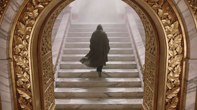 Cinematic cloaked figure ascending marble staircase through gilded arch into misty light