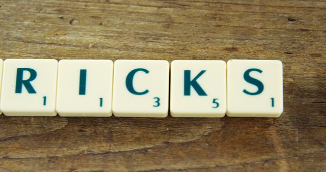 Letters Forming Word Tricks on Wooden Table - Download Free Stock Images Pikwizard.com