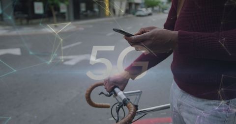 5G Network Concept with Bicyclist Using Smartphone on Street
