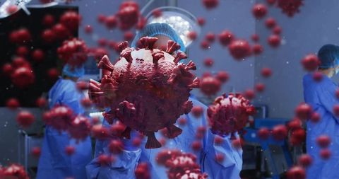 Surgical team wearing ppe working in operating room with giant virus particles surrounding team