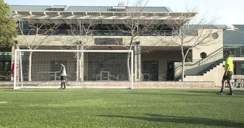 Youth Soccer Players Practicing Teamwork on Training Field