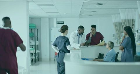 Healthcare Team Collaborating at Modern Hospital Nurse Station