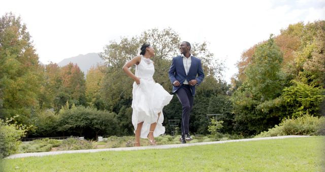 Joyful Bride and Groom Running in Park - Download Free Stock Images Pikwizard.com