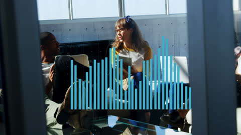 Coworkers Discussing Financial Graphs in Modern Office