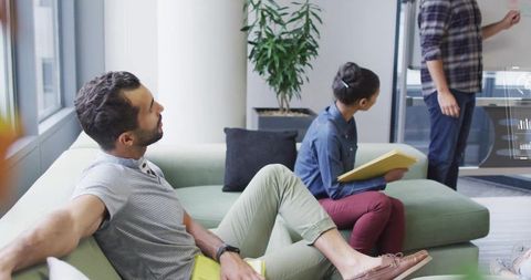 Informal Team Meeting in Modern Office Setting