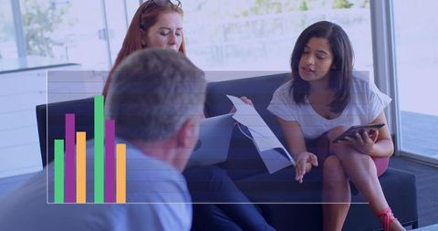 Team discussing analytics in modern office lounge with tablet and bar chart overlay