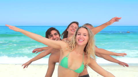Group of Friends Enjoying Time at Beach Seaside