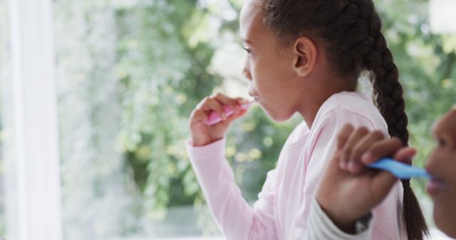 Children Brushing Teeth at Home with Sunlit Background - Download Free Stock Images Pikwizard.com