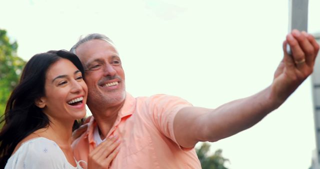 Smiling couple taking selfie in the city - Download Free Stock Photos Pikwizard.com