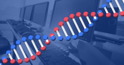 Dna structure overlaying modern office technology concept