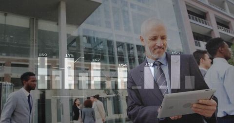 Mature Executive Reviewing Data on Tablet with Analytics Overlay