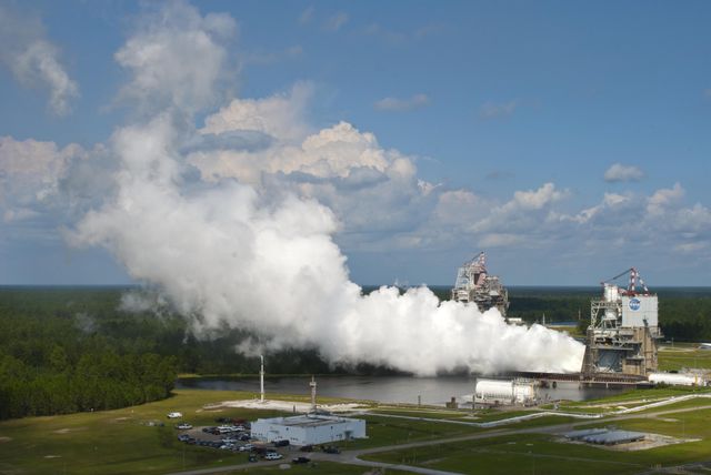 NASA engineers continued testing the next-generation J-2X rocket engine at Stennis Space Center with a 250-second test on Sept. 7. The test was the first conducted after the arrival of Hurricane Isaac forced closure of the Stennis facility for three days in late August. The est was conducted on the A-2 Test Stand at Stennis. The facility's B-1/B-2 Test Stand can be seen in the left background.