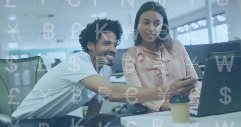 Diverse Colleagues Analyzing Currency Data on Laptop in Modern Office