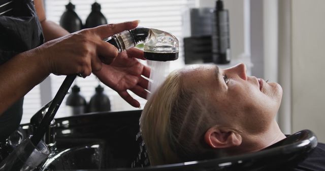 Close-Up of Hair Washer Rinsing Blonde Woman's Hair at Salon - Download Free Stock Images Pikwizard.com