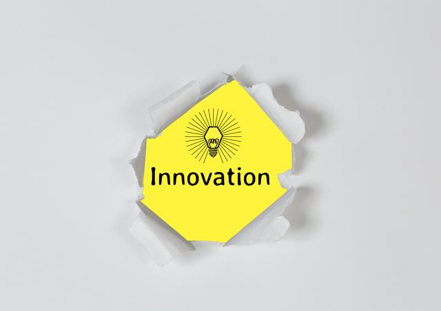 This image shows the word 'Innovation' with a lightbulb icon on a yellow note. The note appears to be torn open from the center. This conveys concepts of creativity, new ideas, and breakthroughs. Perfect for illustrating articles about innovation, business concepts, entrepreneurship, and creative thinking.