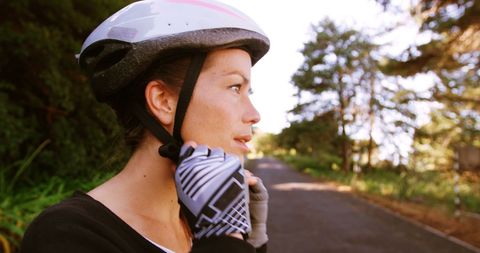 Young Woman in Helmet Standing on Road Ready for Outdoor Adventure - Download Free Stock Images Pikwizard.com